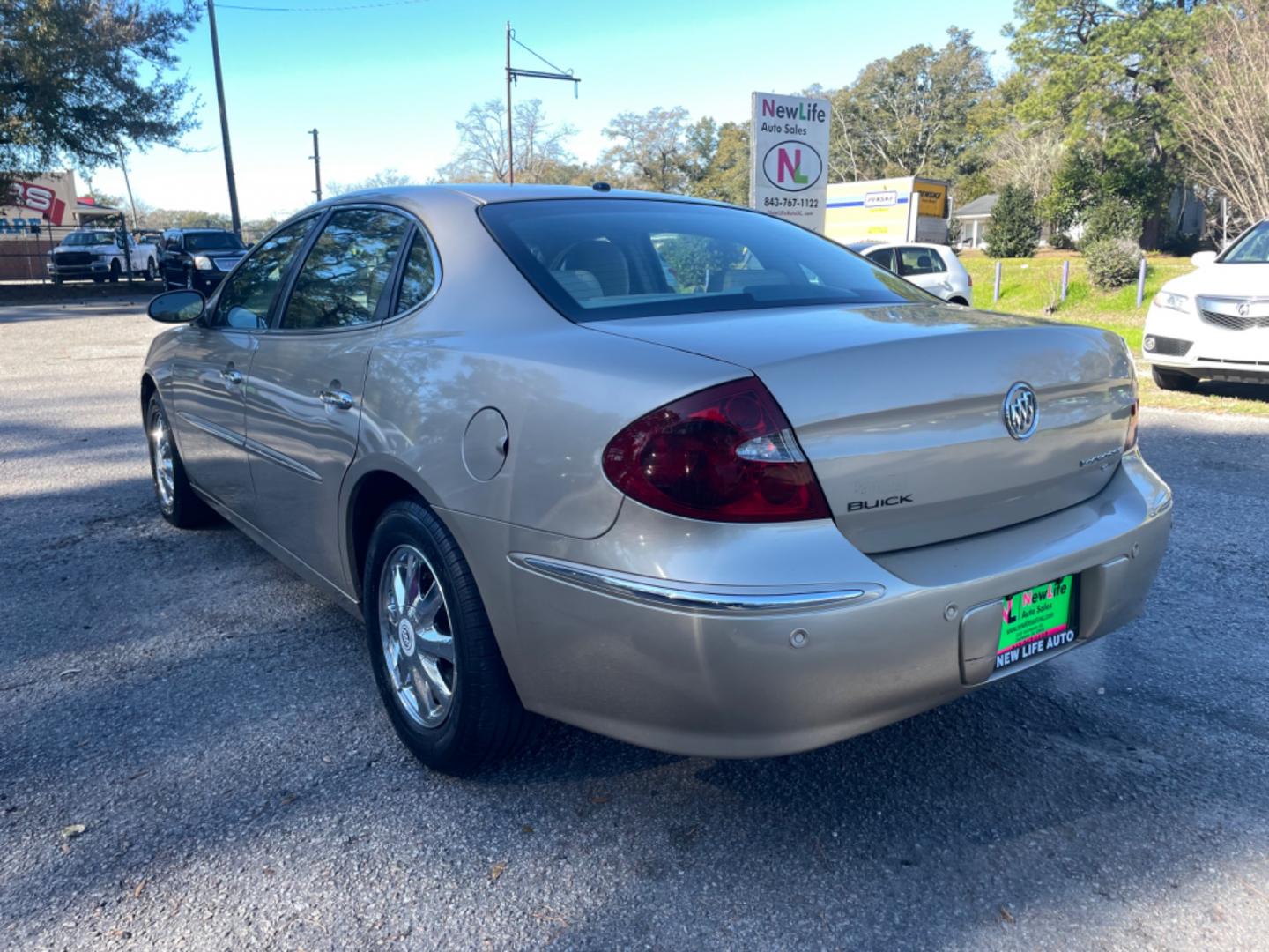 2005 GOLD BUICK LACROSSE CXL (2G4WD562351) with an 3.8L engine, Automatic transmission, located at 5103 Dorchester Rd., Charleston, SC, 29418-5607, (843) 767-1122, 36.245171, -115.228050 - Local Trade-in with Leather, CD/AM/FM, OnStar, Dual Climate Control, Power Everything (windows, locks, seats, mirrors), Keyless Entry, Chrome Wheels. Clean CarFax (no accidents reported!) Only 119k miles! Located at New Life Auto Sales! 2023 WINNER for Post & Courier's Charleston's Choice Pre-owned - Photo#4